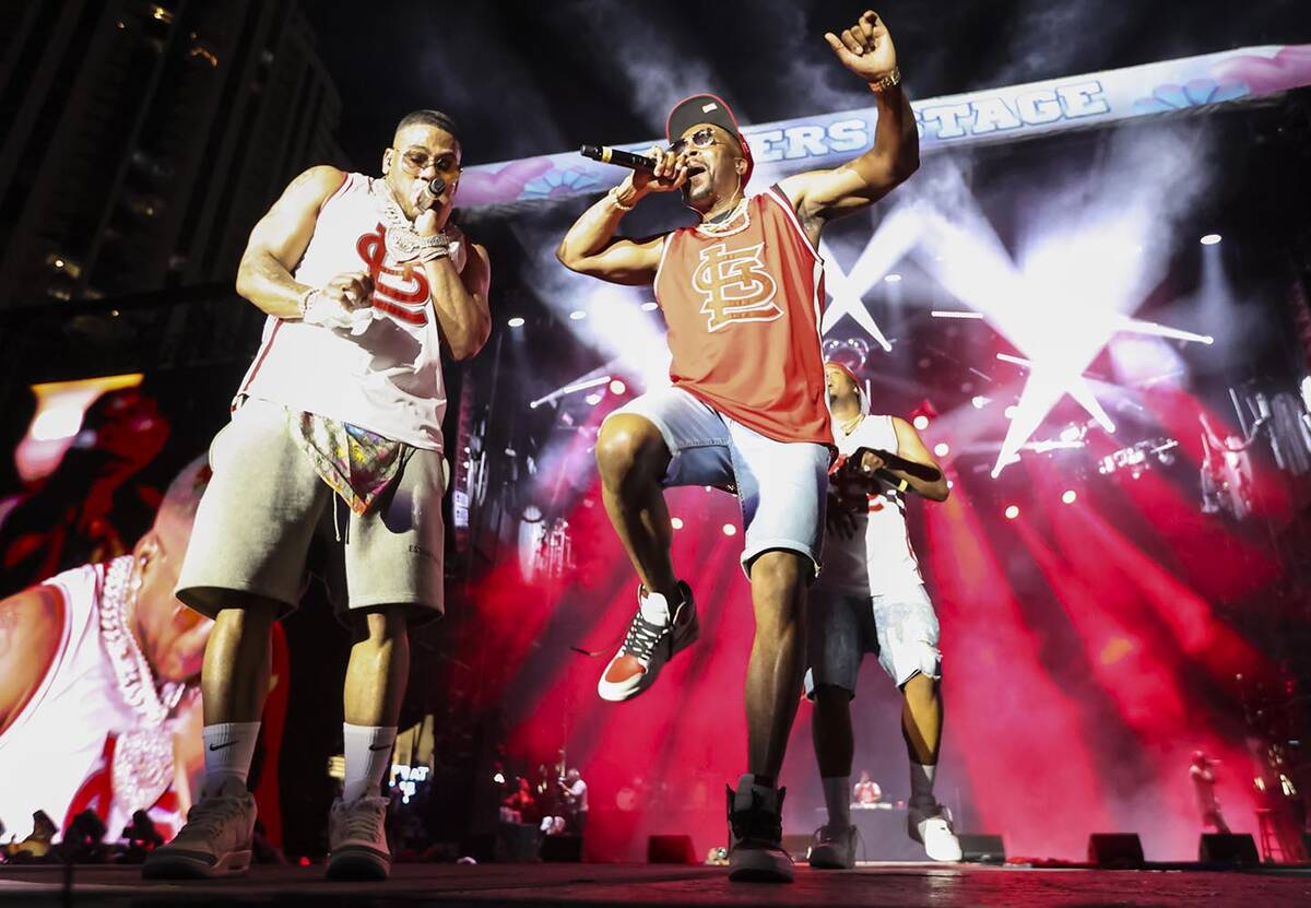 Chingy, right, joins Nelly onstage during the Lovers & Friends music festival on Saturday, ...