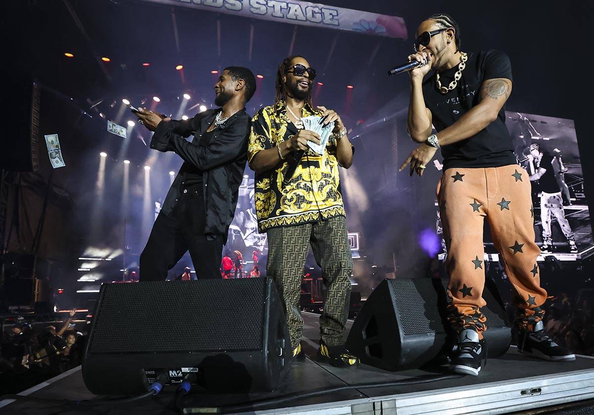 Usher, from left, Lil Jon, and Ludacris performs during the Lovers & Friends music festival ...