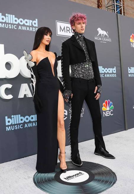 Megan Fox and Machine Gun Kelly pose on the red carpet for the Billboard Music Awards at the MG ...