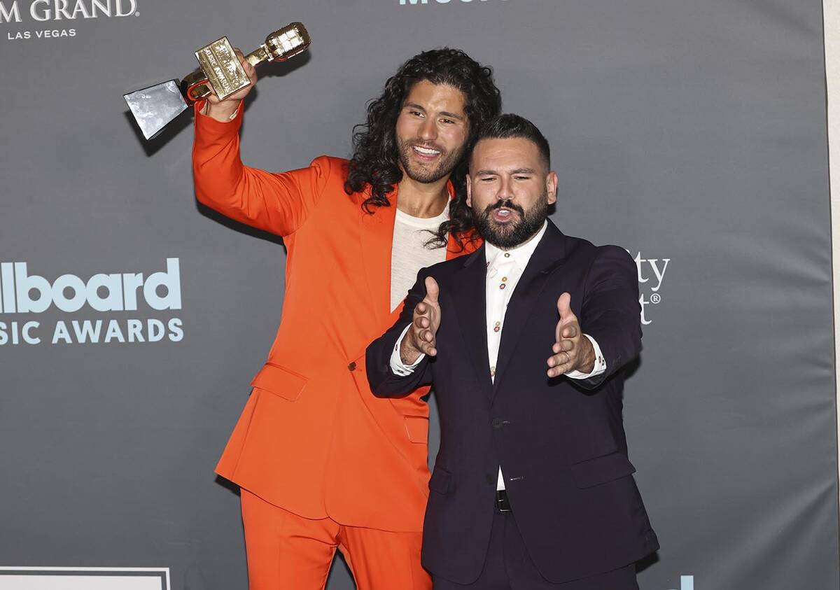 Dan Smyers, left, and Shay Mooney, of duo Dan + Shay, pose with the award for “Top Country Du ...
