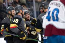 Golden Knights center Jonathan Marchessault (81) is congratulated by teammates including right ...