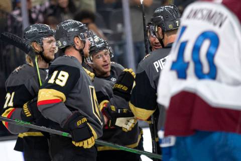 Golden Knights center Jonathan Marchessault (81) is congratulated by teammates including right ...