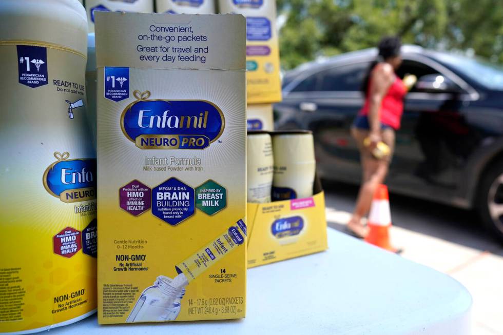 Katherine Gibson-Haynes helps distribute infant formula during a baby formula drive Saturday, M ...