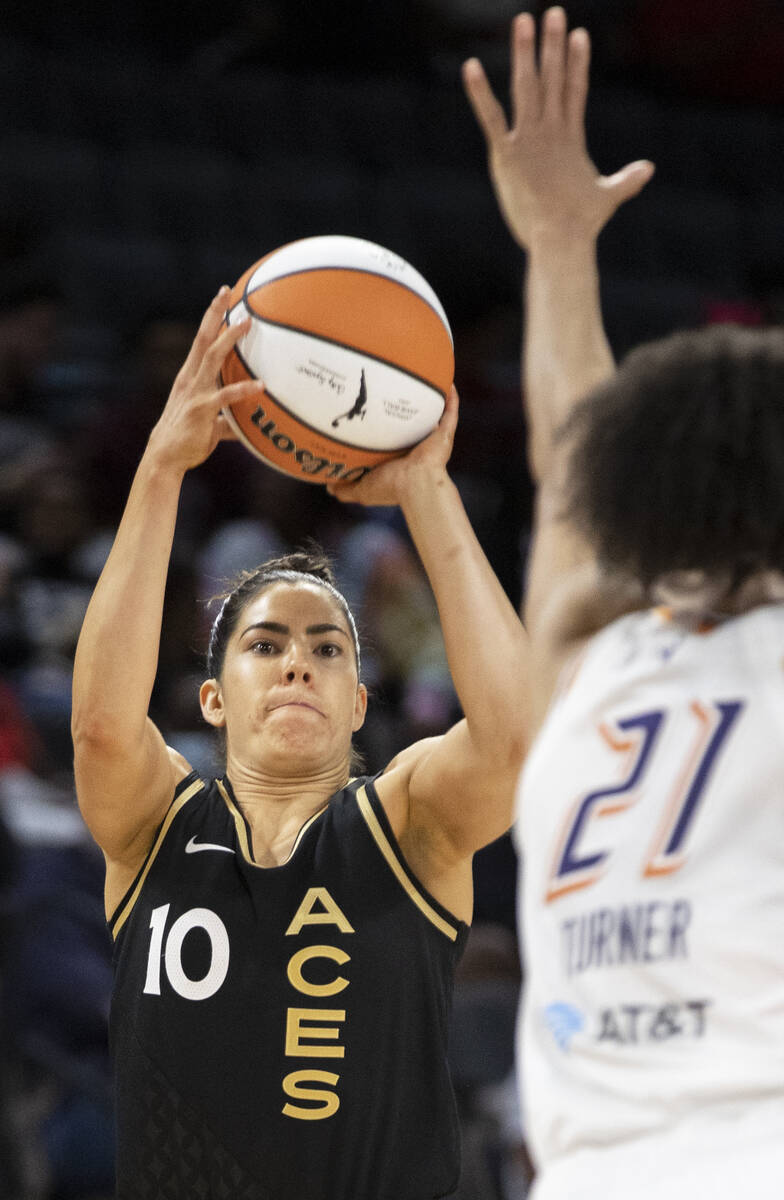 Aces guard Kelsey Plum (10) shoots over Phoenix Mercury forward Brianna Turner (21) in the seco ...