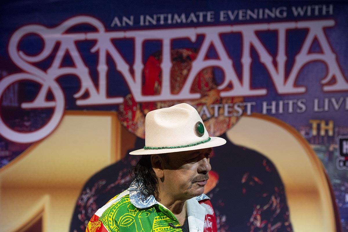 Carlos Santana talks to reporters during a press conference to announce an extension of Santana ...