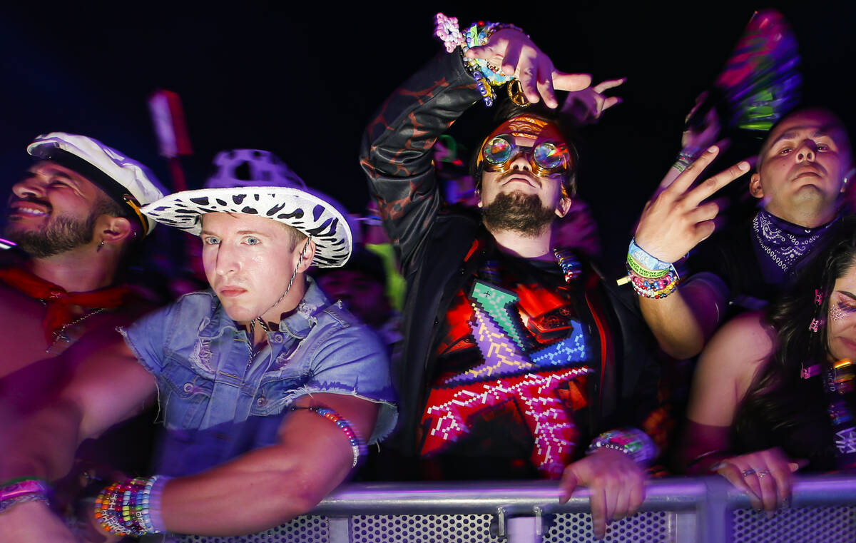 Attendees dance as Excision performs at the Circuit Grounds stage during the first day of the E ...