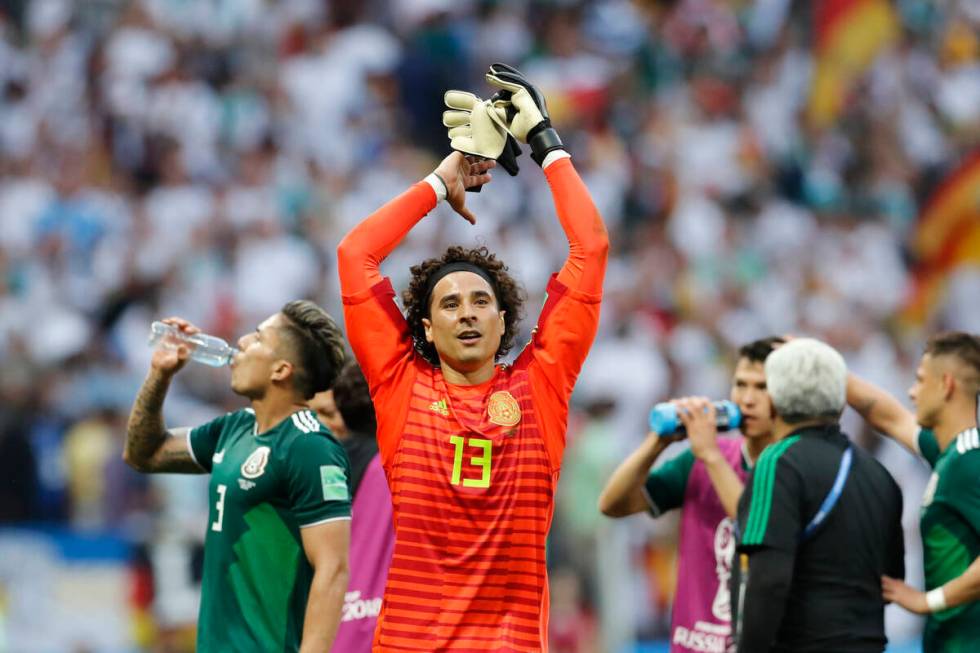 Mexico goalkeeper Guillermo Ochoa celebrates after winning the group F match between Germany an ...