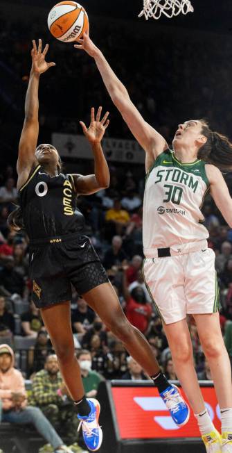 Aces guard Jackie Young (0) has her shot contested by Seattle Storm forward Breanna Stewart (30 ...