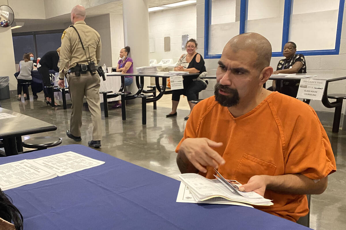 Armando Garcia, 41, talks with a services provider, Wednesday, May 18, 2022, at the Clark Count ...