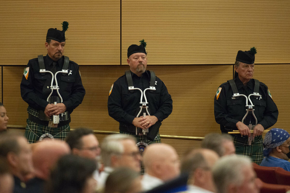 Members of the Las Vegas Emerald Society Pipe Band watch the Southern Nevada Law Enforcement Me ...