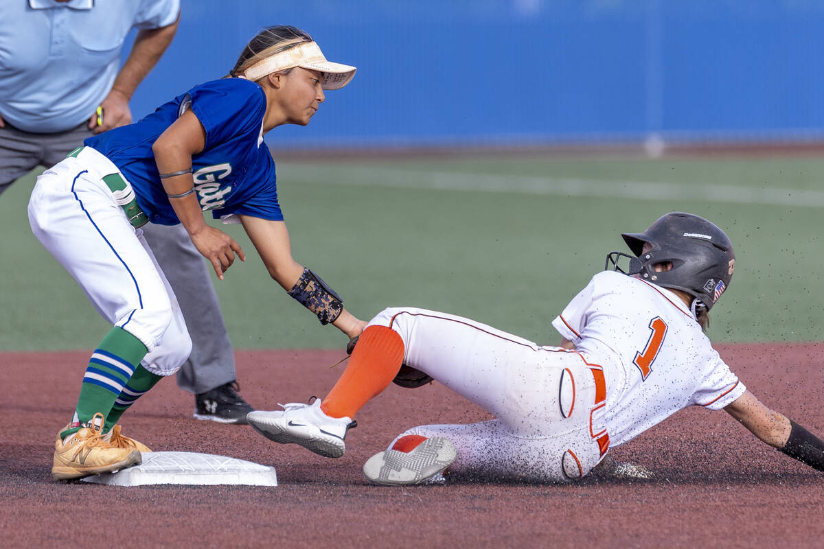 Green Valley infielder Cindy Martinez-Escamilla (7) makes the tag out as Douglas runner Emma St ...