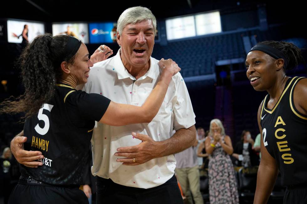 Former Las Vegas Aces head coach Bill Laimbeer embraces forward Dearica Hamby (5) while guard C ...