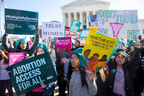 Pro-choice activists supporting legal access to abortion protest during a demonstration outside ...