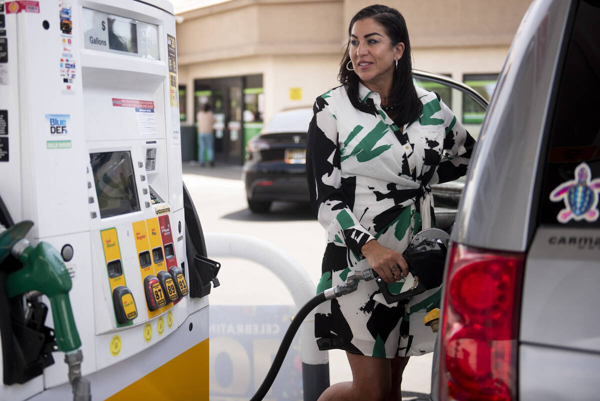 Paola Seminario pumps gas at a Shell station on Charleston Boulevard on Thursday, May 19, 2022, ...