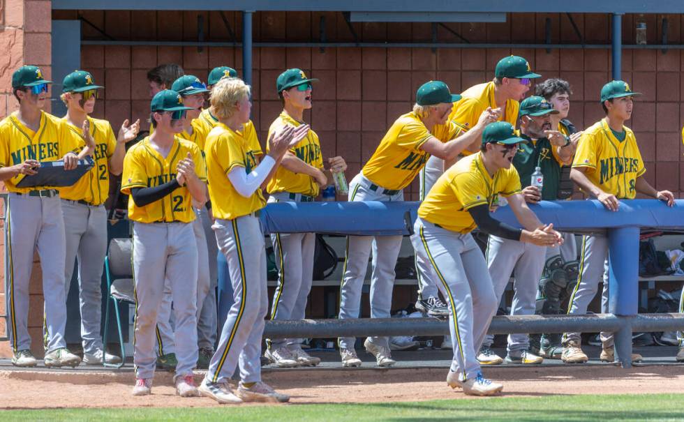 Bishop Manogue players celebrate another run over Basic during their Class 5A state baseball to ...