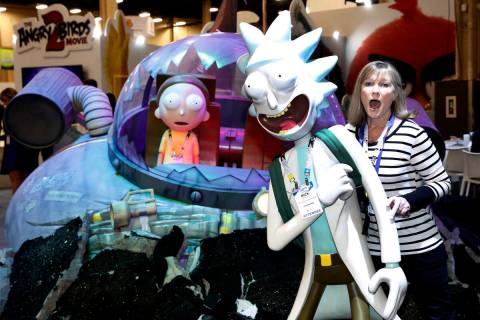 Jane Ashley poses for a photo with a "Rick and Morty" character at the Licensing Expo in 2018 i ...