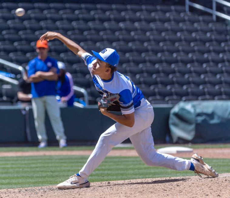 Basic pitcher Aaron Rubio (11) fires another throw to the plate and a Bishop Gorman batter duri ...