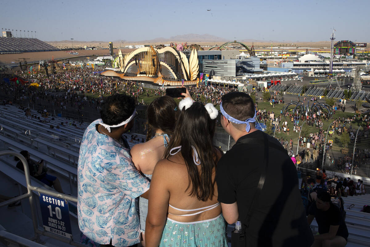 Attendees take selfies before the festival grounds officially open during the first day of the ...