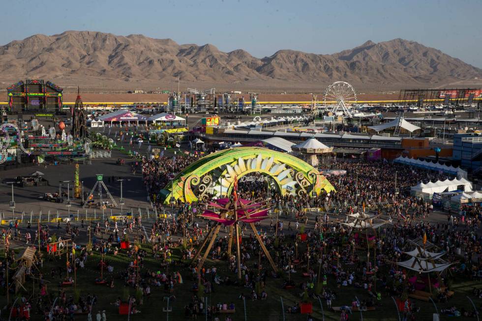 Festival-goers wait for the full grounds to open during the first day of the Electric Daisy Car ...