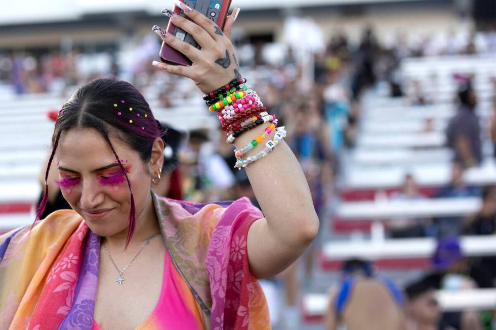 One attendee dances as they enter the festival grounds during the first day of the Electric Dai ...