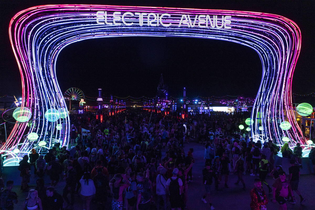 Crowds move through Electric Avenue during the first day of the Electric Daisy Carnival at the ...