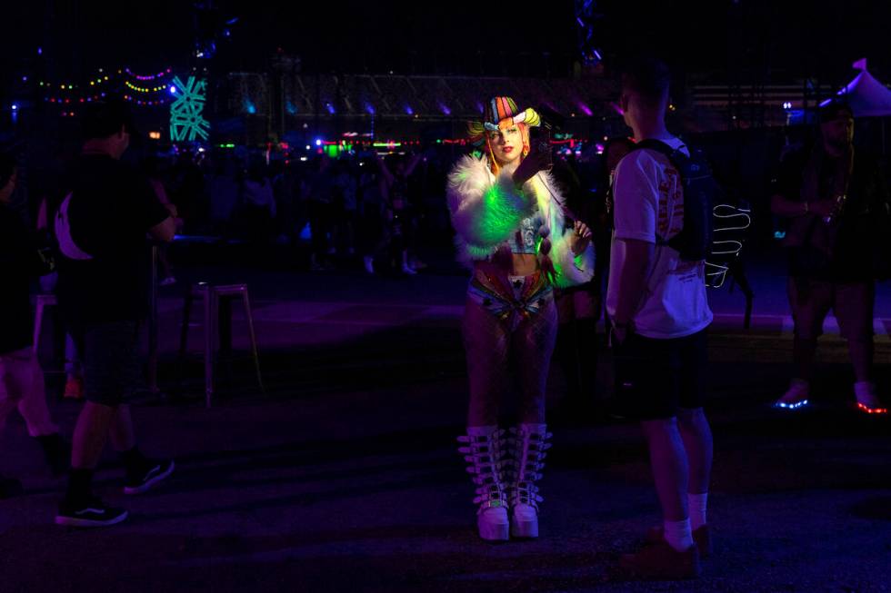 Sophie Hannah, of London, England, takes a selfie during the first day of the Electric Daisy Ca ...