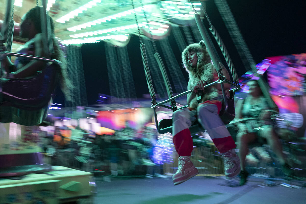The swing ride carries attendees of the Electric Daisy Carnival during the first day of the ele ...