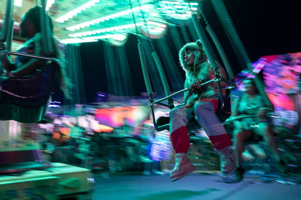 The swing ride carries attendees of the Electric Daisy Carnival during the first day of the ele ...