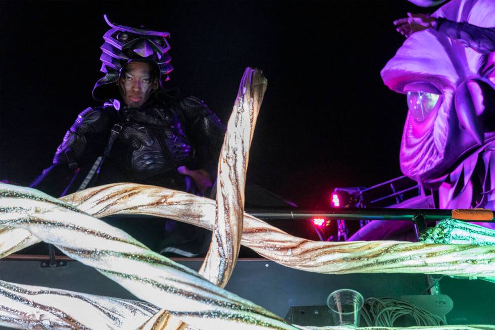 A member of the Owl Guardians performs in an art car during the first day of the Electric Daisy ...