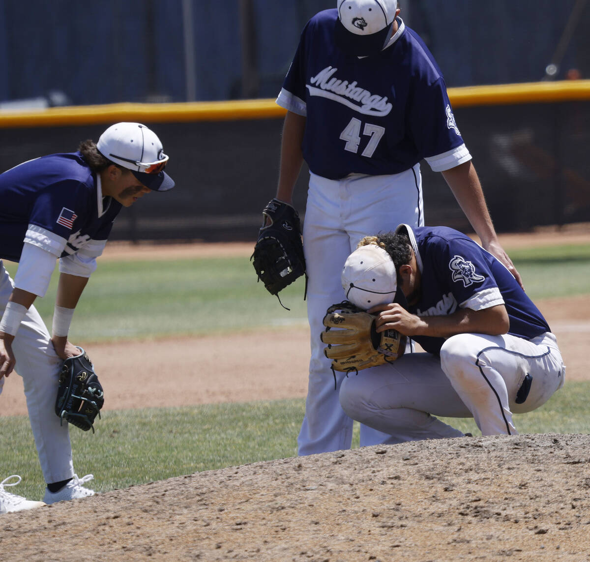 Shadow Ridge pitcher Jordan Bryan reacts after Legacy scored during the ninth inning of the fir ...