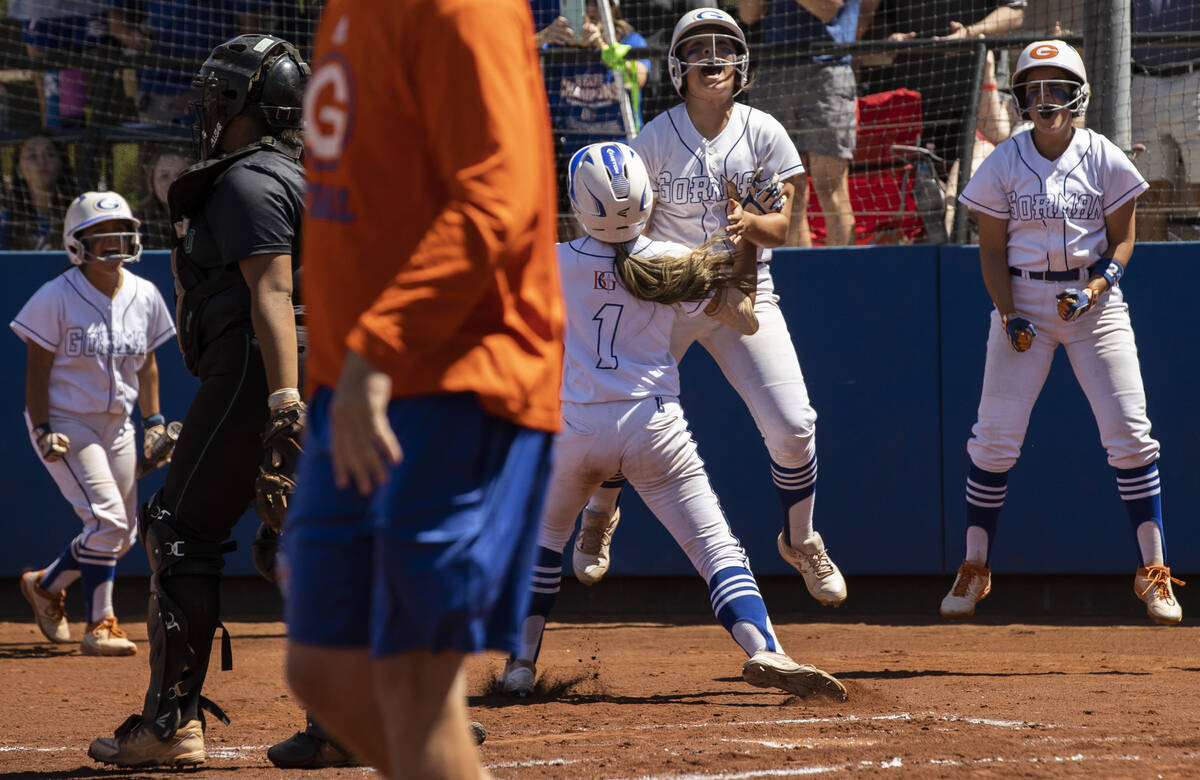 Bishop Gorman’s players celebrate a big offensive play during a Class 4A state softbal ...