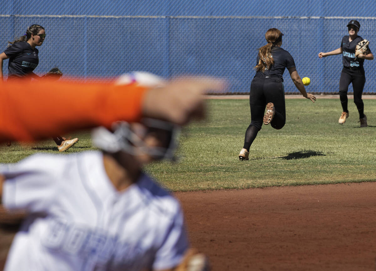 Silverado’s Destiny Capers (4) tries to track down a fly ball as a Bishop Gorman runner ...