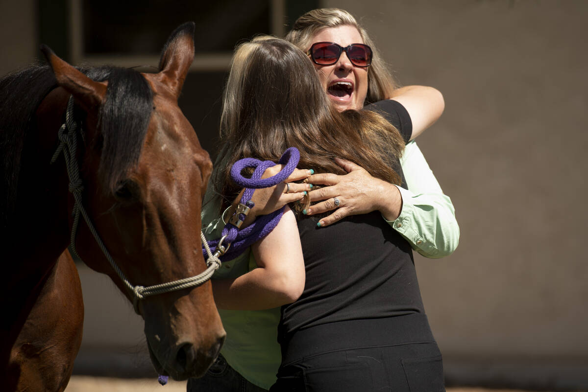 Bailey King, 17, hugs her riding instructor Dania Spor-Orellana after Bailey was gifted her own ...