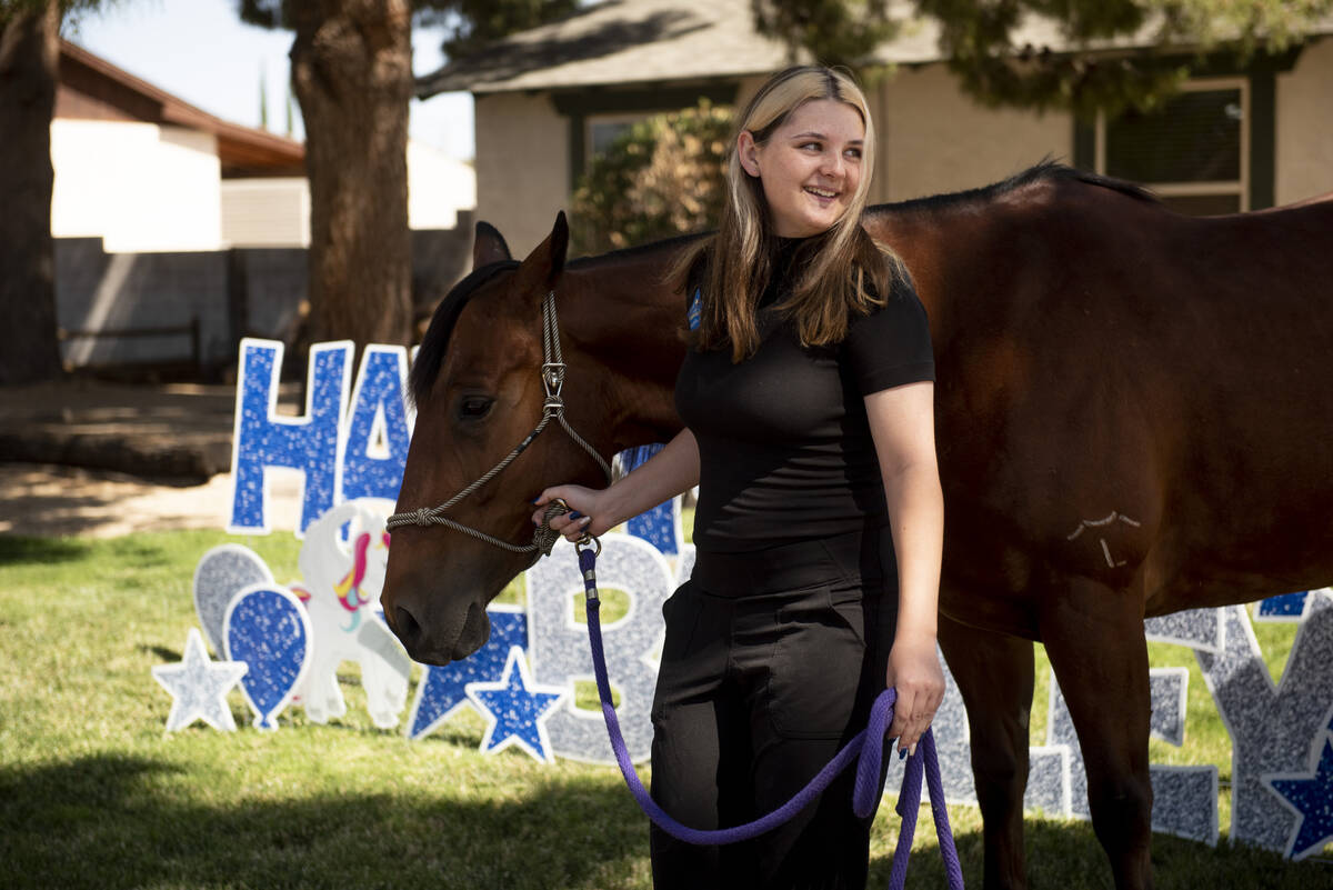 Bailey King, 17, leads her new horse through her front yard on Saturday, May 21, 2022, in Las V ...