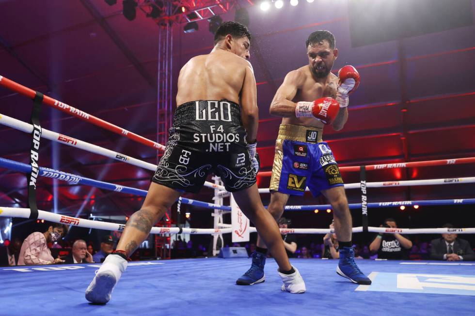Edy Valencia Mercado, right, connects a punch against Jessie Magdaleno in the sixth round of th ...