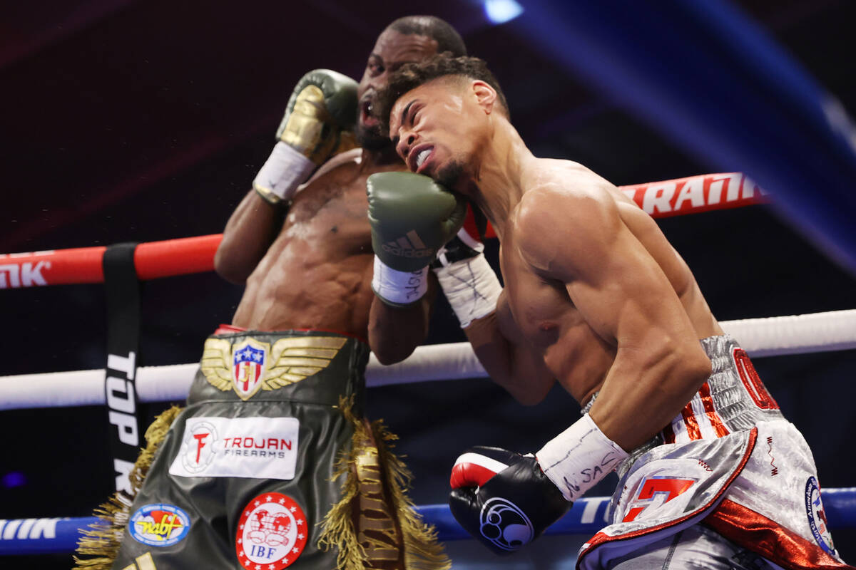 Jamel Herring, left, connects a punch against Jamaine Ortiz in the second round of a lightweig ...