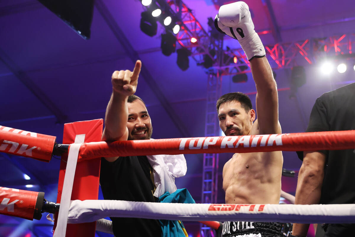 Janibek Alimkhanuly gestures at the crowd after his knockout win in the second round of the WBO ...
