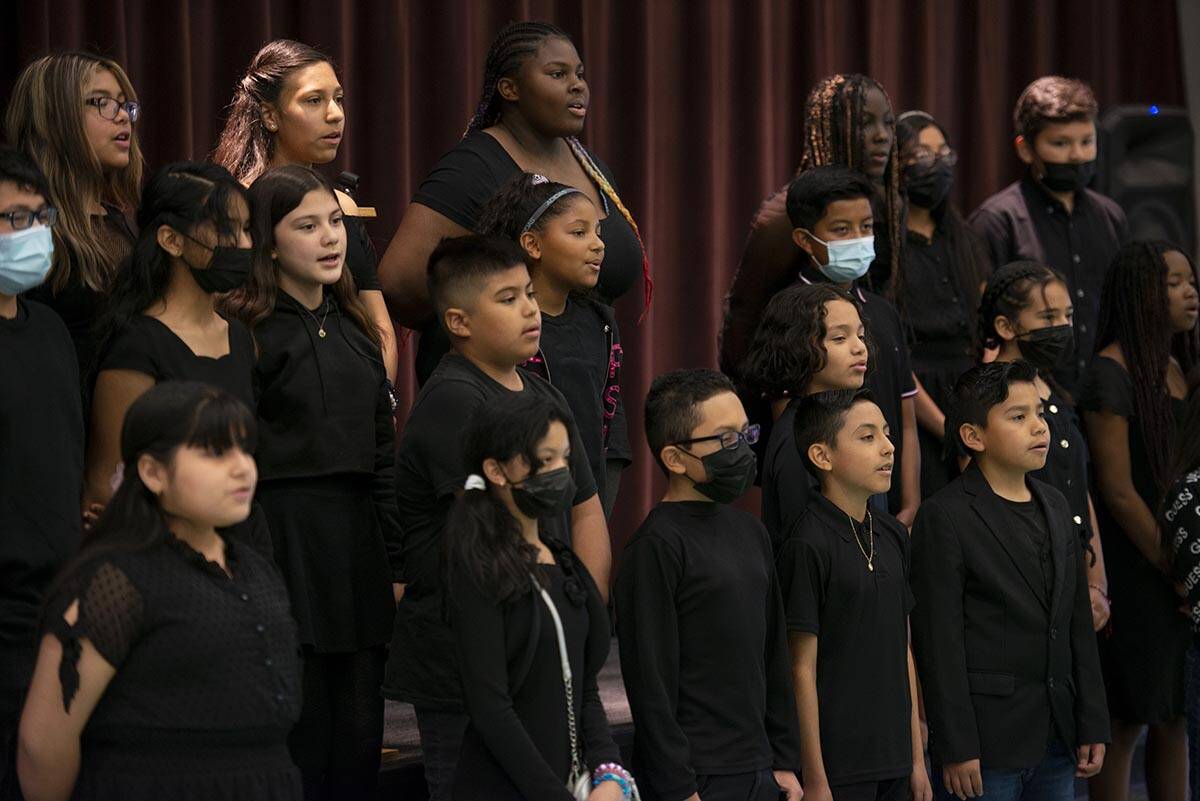 The Reynaldo Martinez Elementary School choir sings "You Raise Me Up" at a tribute ce ...