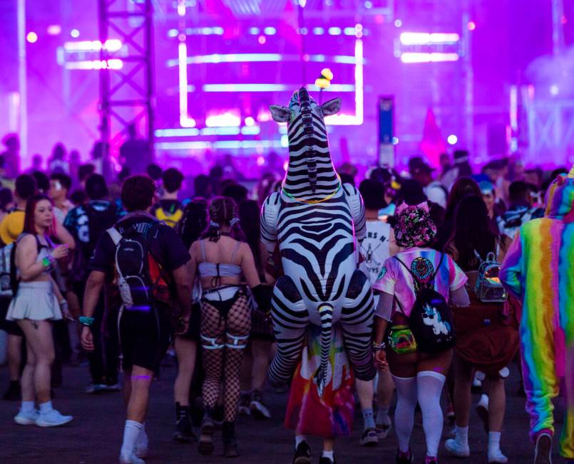 Attendees listen to music at Base Pod during day three of Electric Daisy Carnival on Sunday, Ma ...