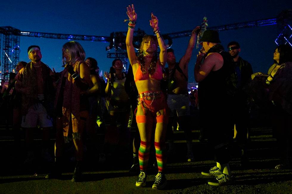 Attendees dance throughout the electronic music festival grounds during the second day of the E ...