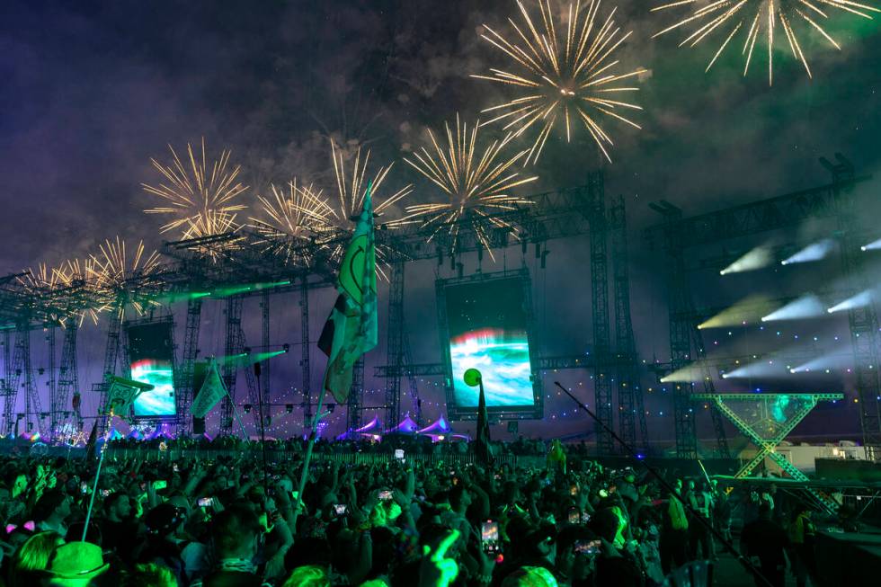 The crowd at KXD, Kaskade and Deadmau5’s new collaboration, turns to watch the fireworks ...