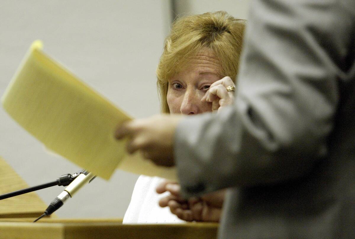 Linda Bailey looks at a photo as she testifies during the penalty phase of her nephew, murderer ...