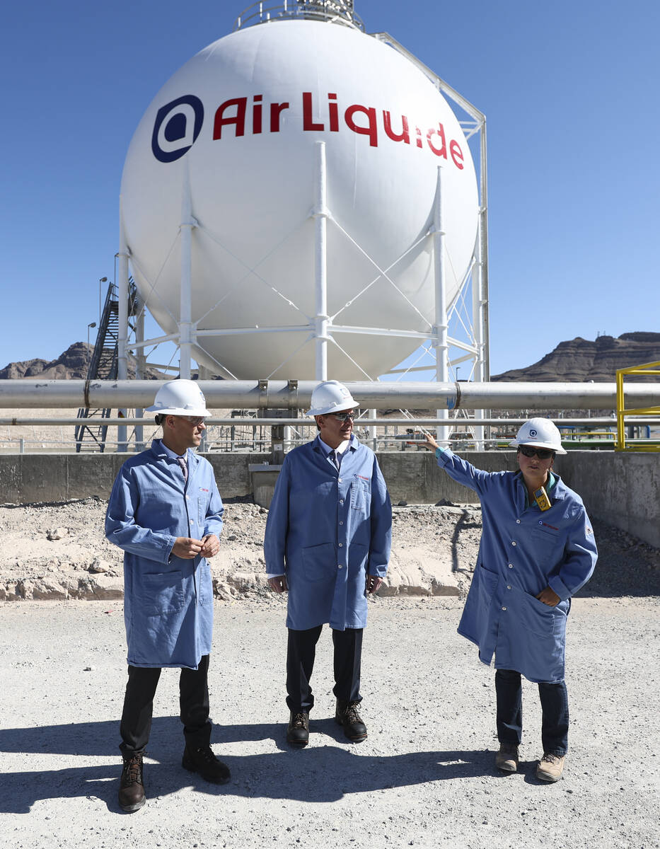 Plant engineer Hannah Nelson, right, talks about the liquid hydrogen storage sphere alongside M ...