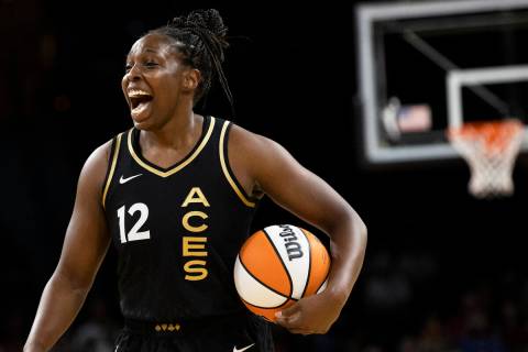 Aces guard Chelsea Gray (12) celebrates a big offensive play in the first half during a WNBA ba ...