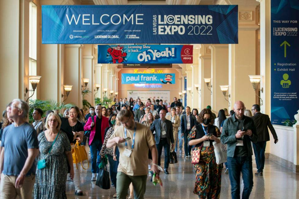 People walk through Mandalay Bay before the opening of the Licensing Expo at the Mandalay Bay C ...