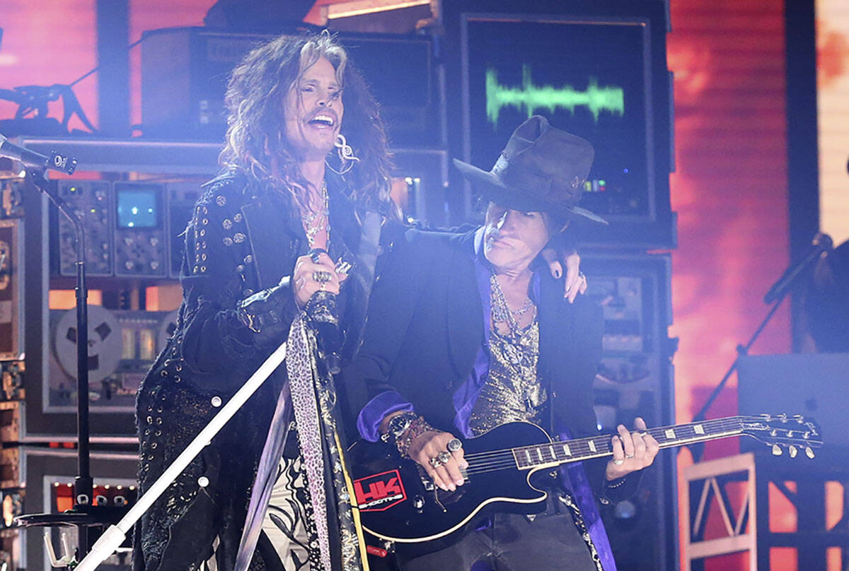 Steven Tyler, left, and Joe Perry of Aerosmith perform at the 62nd annual Grammy Awards, Jan. 2 ...