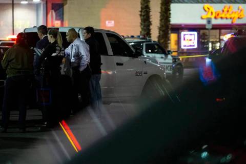 In this May 11, 2022, file photo, Las Vegas police investigate a homicide in the 6100 block of ...