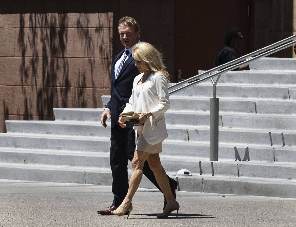 Former Raiders coach Jon Gruden, and his wife Cindy leave the Regional Justice Center after app ...