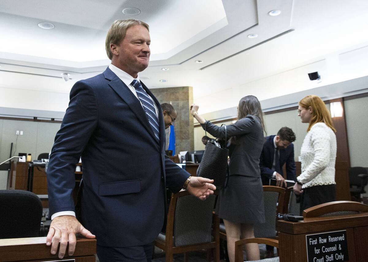 Former Raiders coach Jon Gruden, leaves the courtroom after appearing at a hearing at the Regio ...