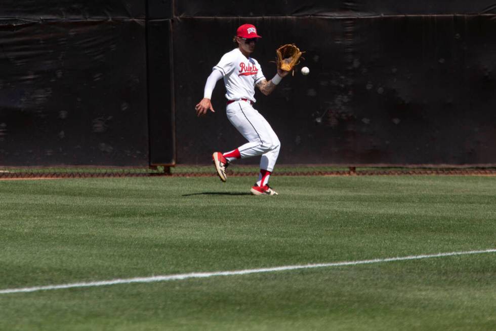 UNLV outfielder Joey Walls (9) reaches to catch during an NCAA baseball game against UNR at Ear ...